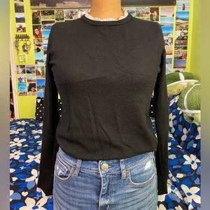 Black sweater with ruffle trim